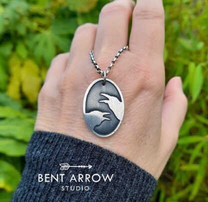 Crows Conversing Oval Pendant